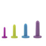 The Intimate Rose Silicone Vaginal Dilators - Small Set, offered by Intimate Rose, consists of four vibrantly colored dilators crafted from medical-grade silicone. Arranged from left to right, the set includes varying sizes in shades of purple, lime green, blue, and lavender. Each dilator is designed with a flat base for enhanced stability to aid pelvic health.