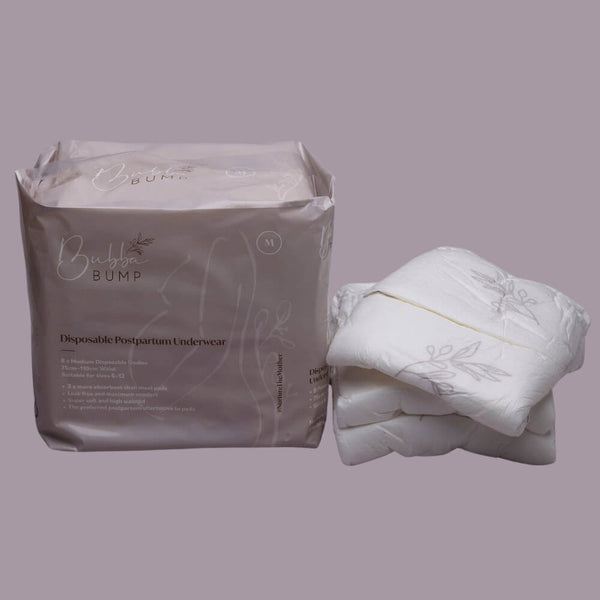 A package of Bubba Bump Disposable Postpartum Underwear in medium size is displayed, with both the product and packaging shown side by side. The white underwear features subtle patterns and is specifically designed for postpartum use. The packaging emphasizes key features such as comfort and leak-proof protection.