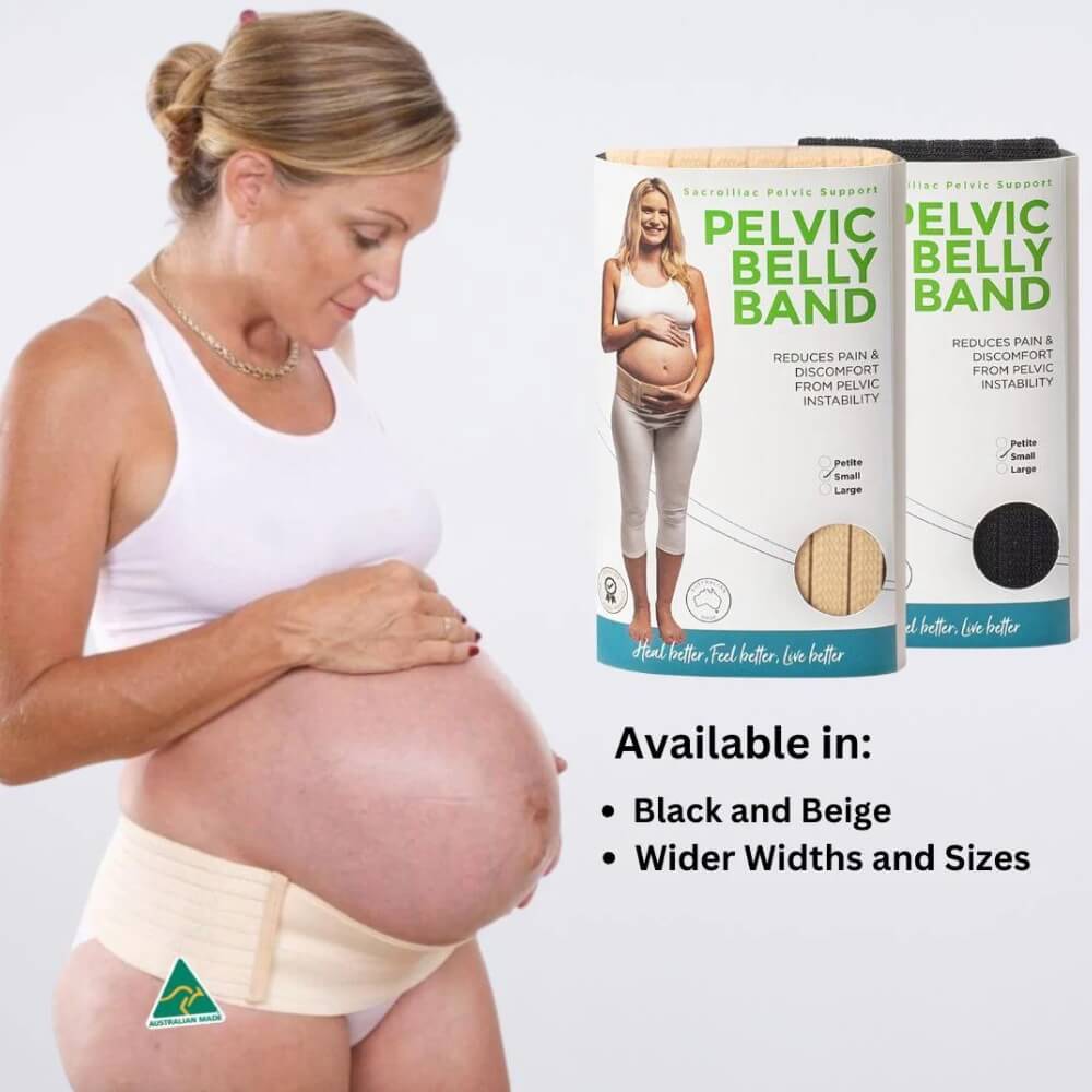 A pregnant woman in a white tank top gently touches her belly while wearing the Belly Bands Maternity Sacroiliac Pelvic Support Belt in beige. Nearby, two boxes showcase a variety of sizes and colors of belly bands, featuring "Black and Beige" options that are designed for wider widths and offer pelvic girdle pain relief.